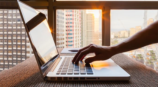 Business person using laptop computer