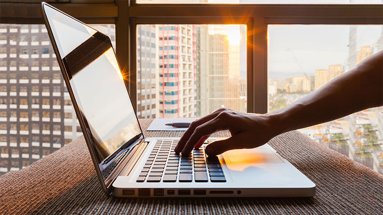 Business person using laptop computer