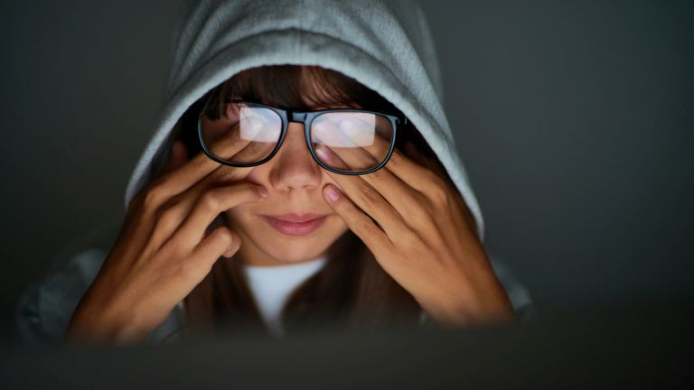 A girl experiences eye strain due to digital screen exposure