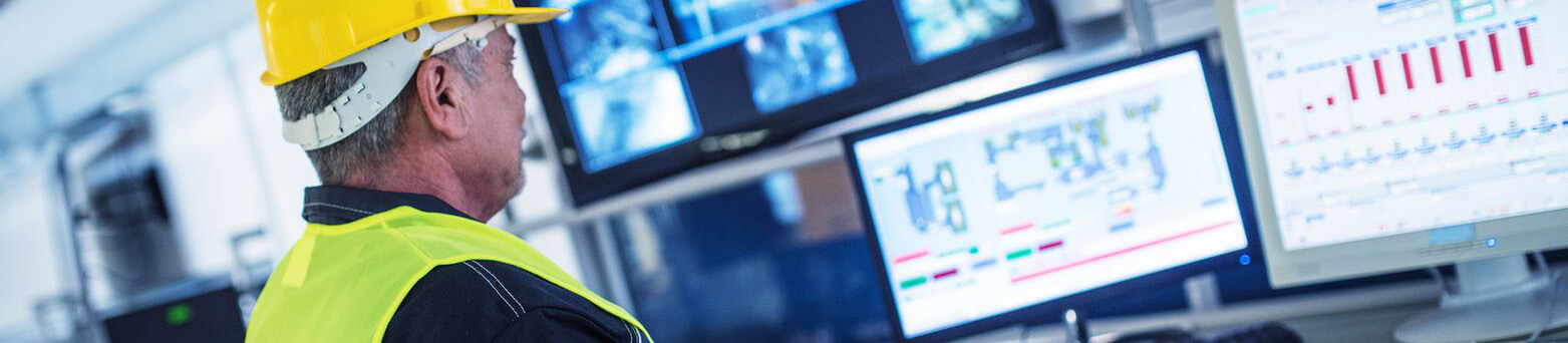 Worker using industrial monitors